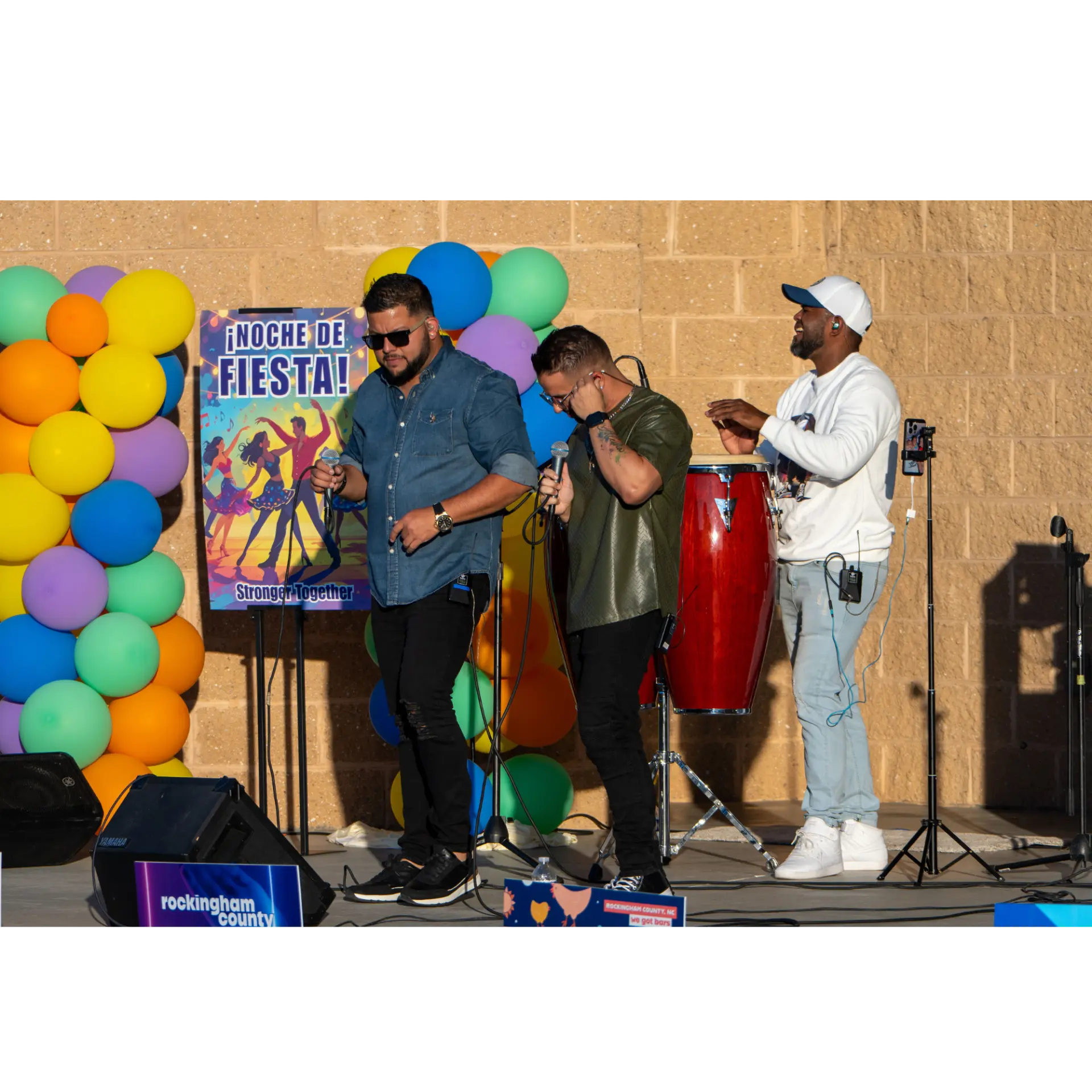 Musicians performing live on the Noche de Fiesta stage